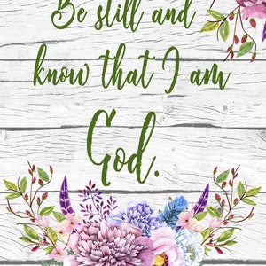 May include: A white wood background with a floral design and the text "Be still and know that I am God. PSALM 46:10" in green lettering.