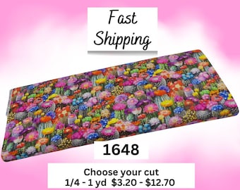 May include: A rectangular piece of fabric featuring a dense, colorful pattern of various cacti with vibrant pink, yellow, blue, and orange flowers. The text "Fast Shipping" appears above the fabric, and "1648" and "Choose your cut 1/4 - 1 yd" appear below.