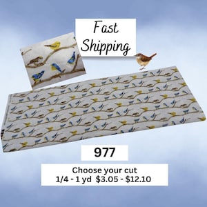 May include: White fabric with a repeating pattern of birds perched on branches in yellow and blue. The fabric has the number "977" and the text "Choose your cut 1/4 - 1 yd". A small bird is also visible.