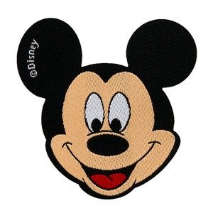 May include: An embroidered patch of Mickey Mouse's face, featuring black and white stitching and a red tongue. The patch has the word "Disney" in white text on the left ear.