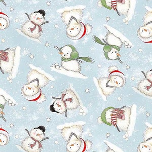 May include: A blue and white patterned fabric with a repeating design of snowmen playing in the snow. The snowmen are wearing hats, scarves, and mittens. There are small white snowflakes scattered throughout the pattern.