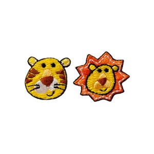 May include: Two embroidered iron-on patches, one of a tiger and one of a lion. The tiger patch is yellow with orange stripes and a white face. The lion patch is yellow with an orange mane and a white face.