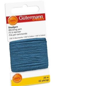 Puede incluir: Una bobina de hilo para zurcir Gütermann Creativ azul, 100% algodón, de 20 metros (22 yardas) de largo. La etiqueta dice "Stopfgarn Mending yarn Fil à repriser Filo per rammendo 100% Baumwolle/100% Cotton/100% Cotone".