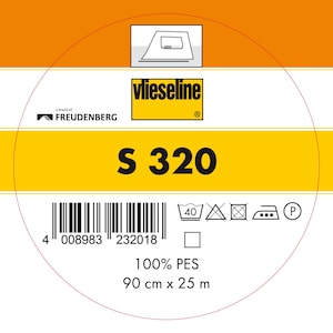 Pode incluir: Um rótulo amarelo e branco com o texto "vlieseline" e "S 320". O rótulo também inclui um código de barras, instruções de lavagem e o texto "100% PES 90 cm x 25 m".