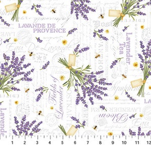 May include: White fabric with a repeating pattern of lavender sprigs, bees, and text in a light gray font. The text includes "Lavender", "Provence", "Fields of Lavender", and "Lavender Tea".