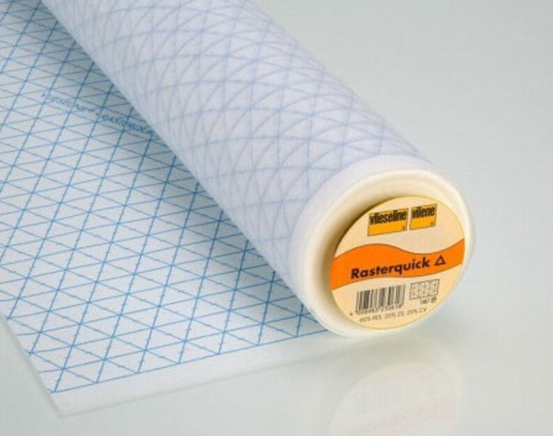 May include: A roll of white fabric with a blue grid pattern. The fabric is labelled "Rasterquick A" and "Vlieseline Vilene".