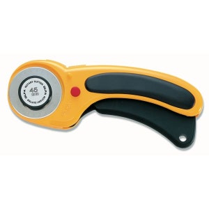 May include: Yellow and black rotary cutter with a 45mm blade. The cutter has a safety lock and a comfortable grip.
