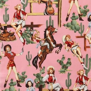 May include: Pink fabric with a repeating pattern of cowgirls, horses, cacti, and a guitar. The cowgirls are wearing cowboy hats, boots, and denim shorts. The horses are brown and white. The cacti are green. The guitar is brown.