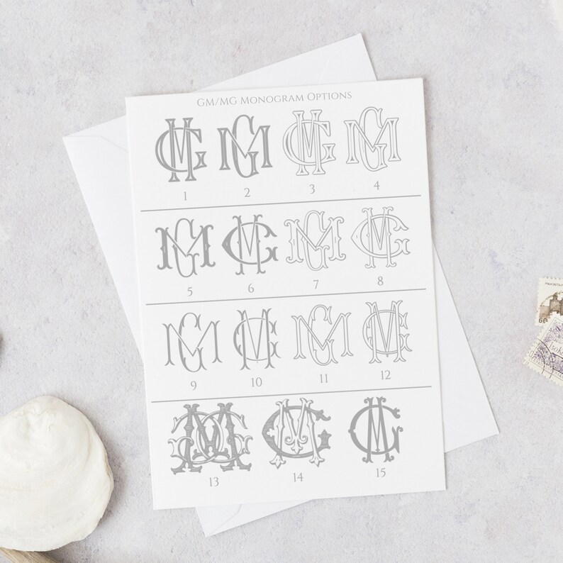 Może przedstawiać: Biała karta z 15 r&oacute;żnymi opcjami monogramu dla liter GM lub MG. Opcje są ponumerowane od 1 do 15. Karta zawiera tekst "GM/MG MONOGRAM OPTIONS" u g&oacute;ry.