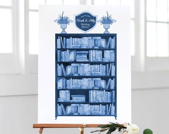 May include: A blue and white wedding guest book sign with a bookshelf design. The sign says "Noah & Ally Wedding Library" and "July 22, 2023".