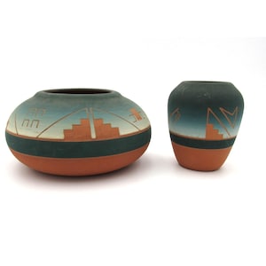 May include: A distressed wooden sign, reading "Welcome to our home" in white lettering. The sign has a rustic finish, ideal for a front porch or hallway, creating a welcoming atmosphere.