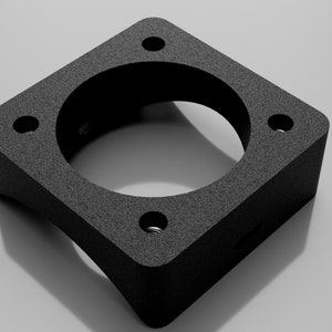 May include: Black square-shaped metal adapter with four holes and a round opening in the center.