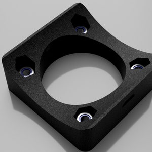 May include: Black plastic 3D printed part with five holes and a rounded edge. The part has a textured surface.
