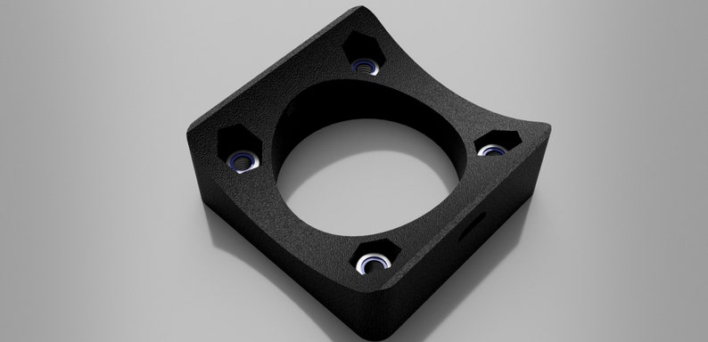 May include: Black plastic 3D printed part with five holes and a rounded edge. The part has a textured surface.