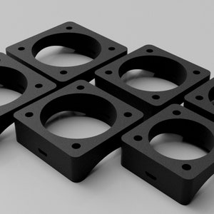 May include: Six black plastic fan mounts with square bases and circular openings. The mounts are designed to hold fans in place.