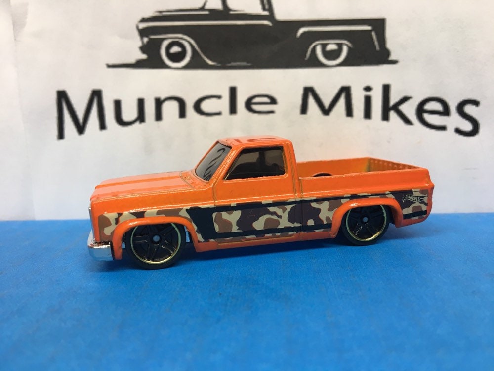 Collectible 2018 Hot Wheels 1983 Chevy Silverado Pick Up Truck Orange Camouflage With Custom Clear Display Case