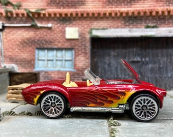 Loose Hot Wheels Shelby Cobra 427 S/C Dressed in Dark Red With Flames