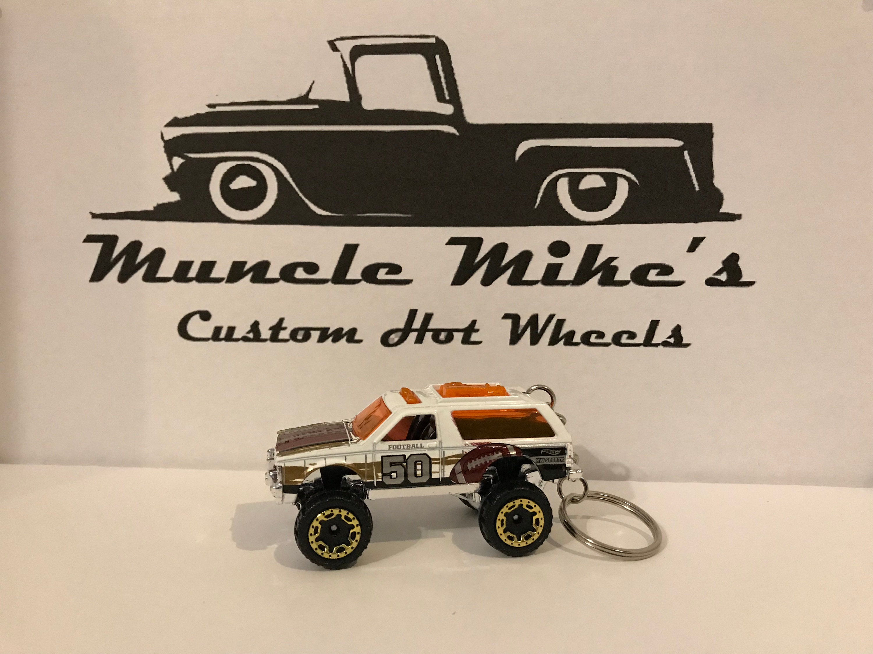 Custom Hot Wheels white Chevy Blazer 4x4 with football graphics Christmas Ornament, Keychain or Zipper Pull