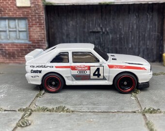 Custom Hot Wheels 1984 Audi Sport Quatro In White Red and Green Livery With Black and Red 4 Spoke Race Wheels With Rubber Tires