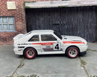 Custom Hot Wheels 1984 Audi Sport Quatro In White Red and Green Livery With Chrome and Red 4 Spoke Race Wheels With Rubber Tires