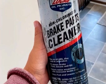 May include: A black and blue can with a white label that says "Lucas Oil Products Inc." and "Non-Chlorinated Brake Parts Cleaner". The can has a distressed look and a picture of a brake rotor on the bottom.