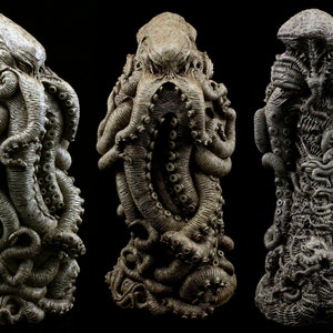 May include: A detailed, gray, sculpted figure of a multi-legged creature with a textured surface. The creature has a large head with multiple eyes and tentacles.