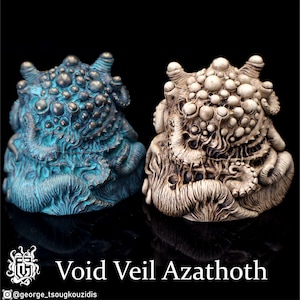 May include: Two detailed sculptures of a monstrous creature with a textured surface. One sculpture is painted in shades of blue and green, while the other is painted in shades of white and brown. The sculptures are titled "Void Veil Azathoth".