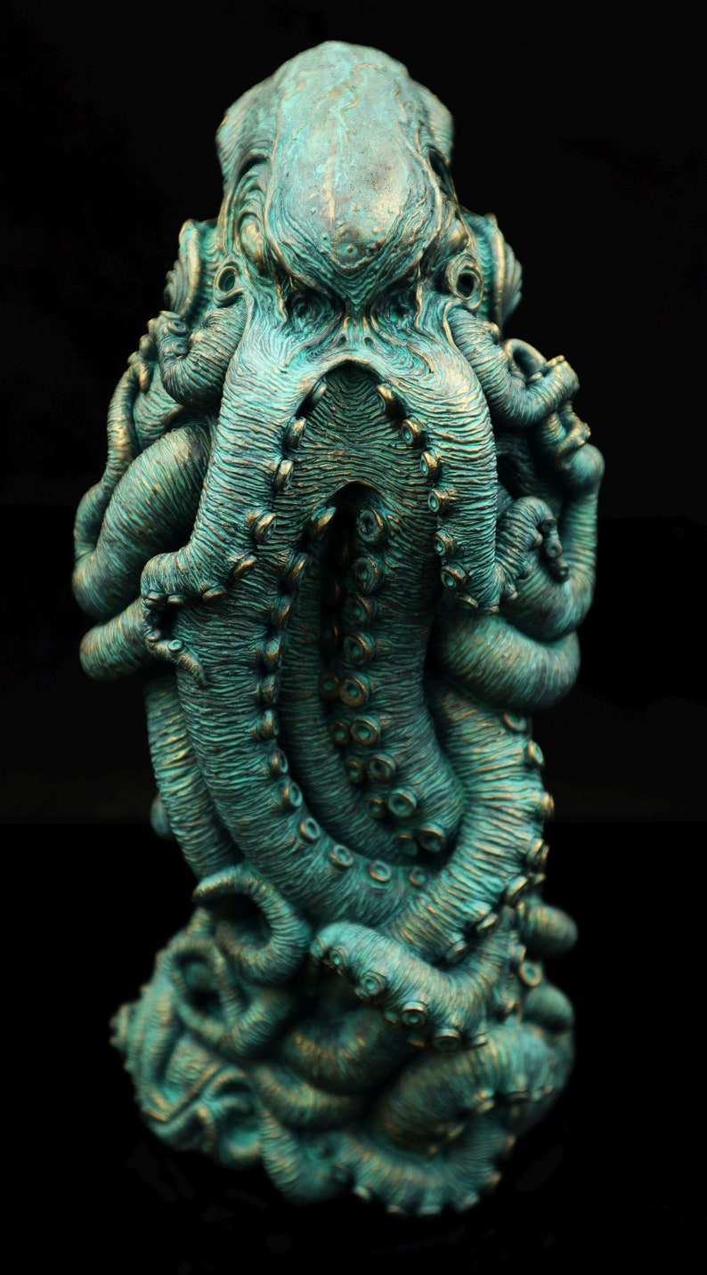 May include: A teal green octopus sculpture with detailed tentacles and a textured surface.