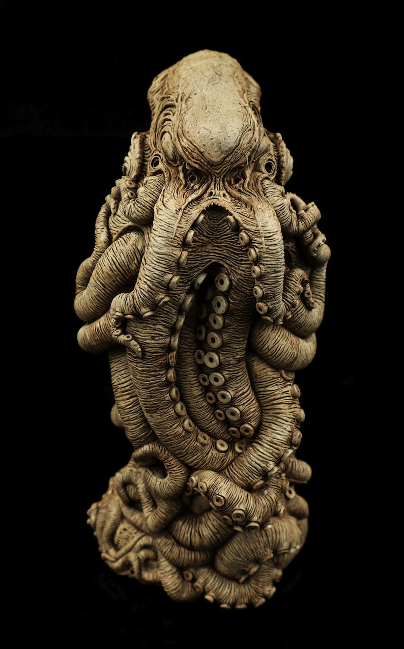 May include: A detailed ceramic sculpture of an octopus with a textured, aged appearance. The octopus is curled in on itself, with its tentacles intertwined. The sculpture is a dark brown color.