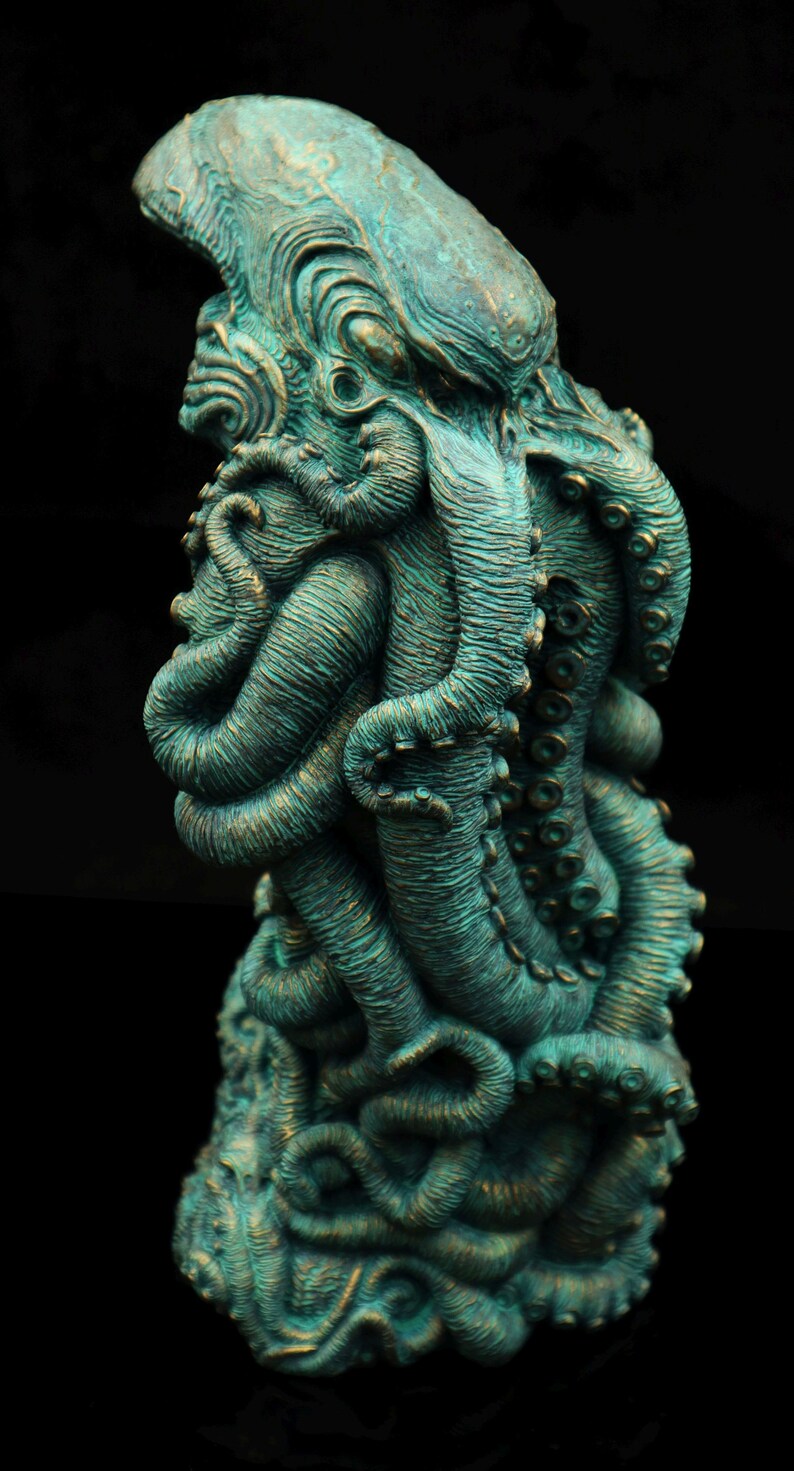May include: A teal green, detailed sculpture of an octopus with its tentacles wrapped around itself. The sculpture is made of a textured material and has a realistic appearance.