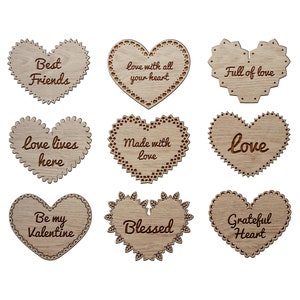 May include: Nine different heart-shaped wood cutouts with various sayings, including "Best Friends", "Love with all your heart", "Full of love", "Love lives here", "Made with love", "Love", "Be my Valentine", "Blessed", and "Grateful Heart".