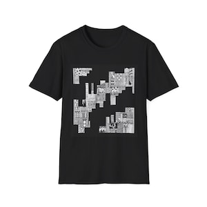 May include: A black short-sleeve t-shirt featuring a central square graphic composed of intricate white line art patterns. The design consists of various geometric shapes, cross-hatching, and detailed textures arranged in a fragmented, abstract layout.