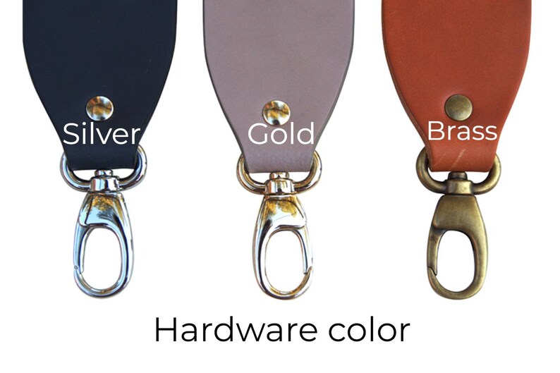 May include: Three leather straps with different colored hardware. The strap on the left has silver hardware, the middle strap has gold hardware, and the strap on the right has brass hardware. The text "Hardware color" is written below the straps.