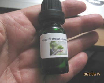Moldavite infused essential Lavender oil ,10ml with a genuine moldavite inside