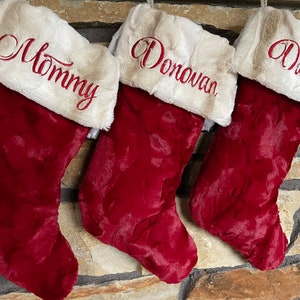Traditional Christmas Stockings.  Fur Cuffs are ivory and tan with a Wooden Snowflake Ornament.  Very Soft Stockings