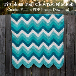 May include: A crocheted blanket with a chevron pattern in shades of teal and cream.