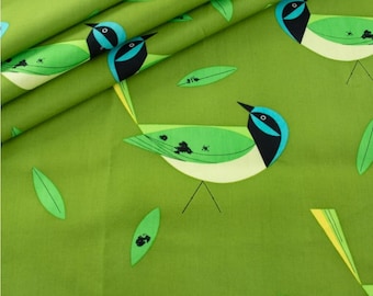 May include: Green fabric with a repeating pattern of stylized birds and leaves. The birds have black, blue, and green details. The leaves are green. The background is a solid, light green color. The fabric is likely cotton or a similar material.