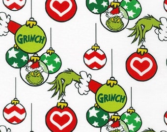 May include: A white background with a repeating pattern of green, red, and white Christmas ornaments. The ornaments feature a Grinch character, hearts, and stars. The text "Grinch" appears on some of the ornaments.