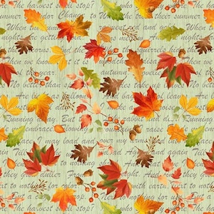 May include: A pale green fabric featuring a repeating pattern of autumn leaves in red, orange, yellow, and brown. The design includes script text, acorns, and berries.
