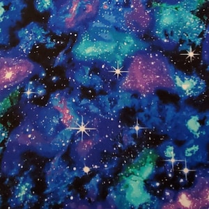 May include: A blue, purple, and green galaxy print fabric with white stars. The fabric has a watercolor effect.