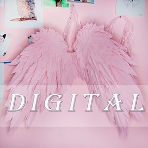 May include: Large, pale pink angel wings with a layered feather design. The wings are displayed against a pink wall, with the word "DIGITAL" overlaid on the image. The wings are attached to a clear plastic frame.
