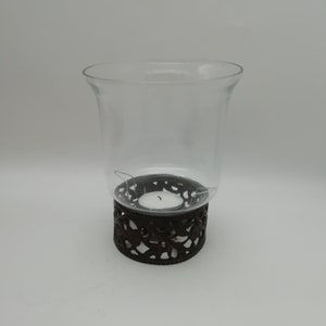 Tealight holder in glass and wrought metal
