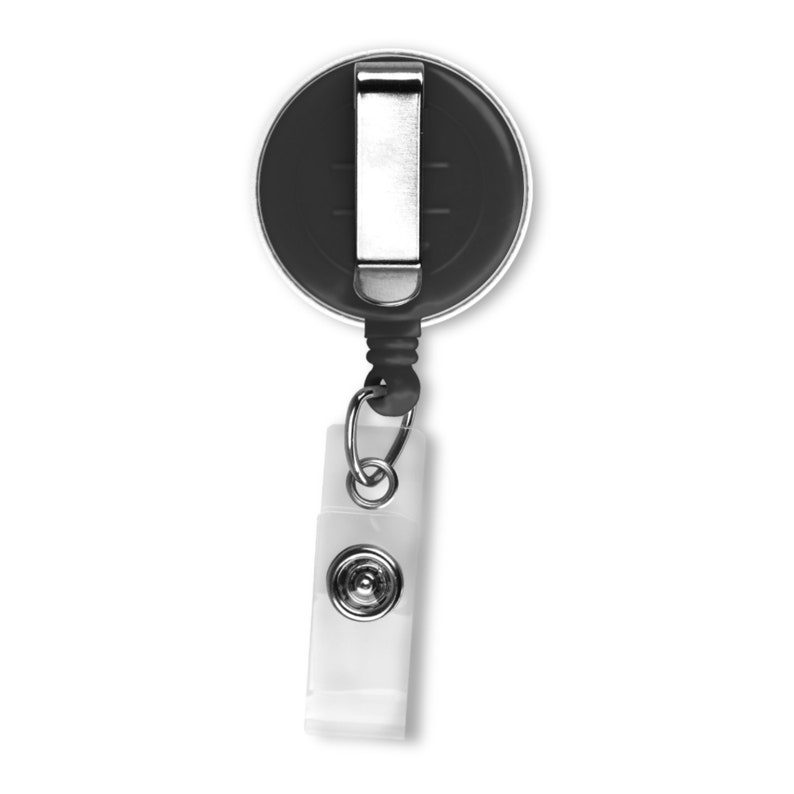 May include: A black retractable badge holder with a silver clip and a clear plastic strap. The badge holder is attached to a silver swivel hook.