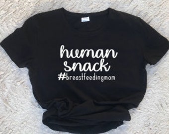 May include: Black t-shirt with white text that reads "human snack #breastfeedingmom"