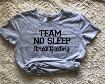 May include: Gray t-shirt with black text that reads "TEAM NO SLEEP #breastfeeding".