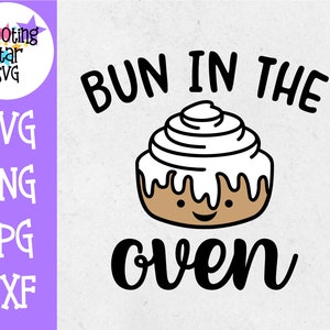 May include: A black and white illustration of a cinnamon roll with a smiling face. The text "Bun in the oven" is written above the roll.
