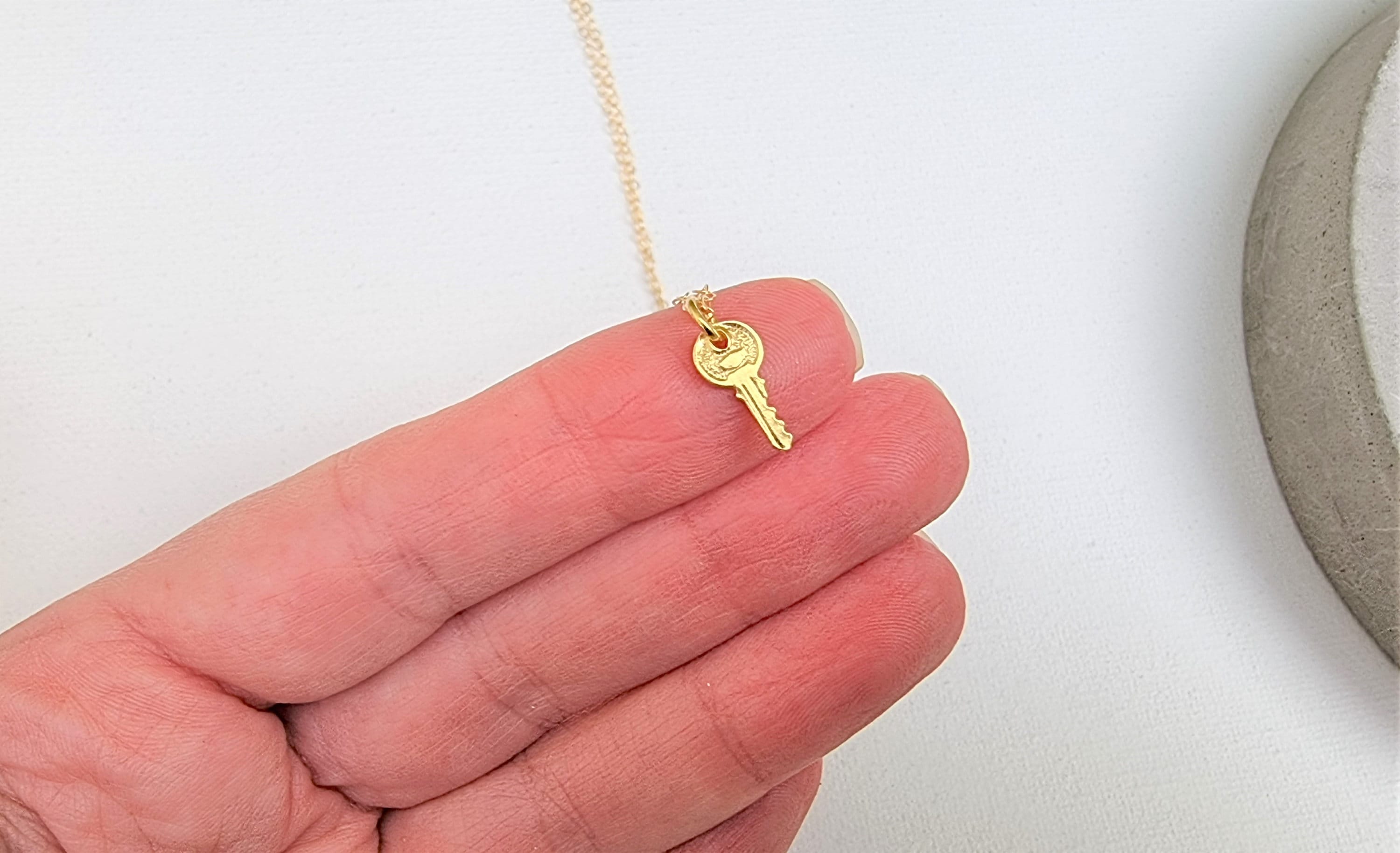 Tiny gold key necklace deals