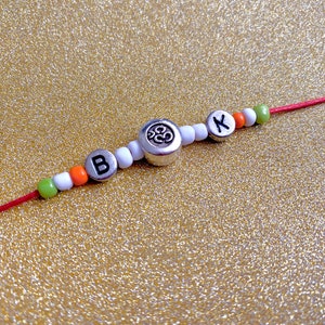 Aum Rakhi with Initial – Personalised Om Rakhi Bracelet – Handmade Raksha Bandhan Gift – Custom Red Thread Rakhi for Brother - unique gift