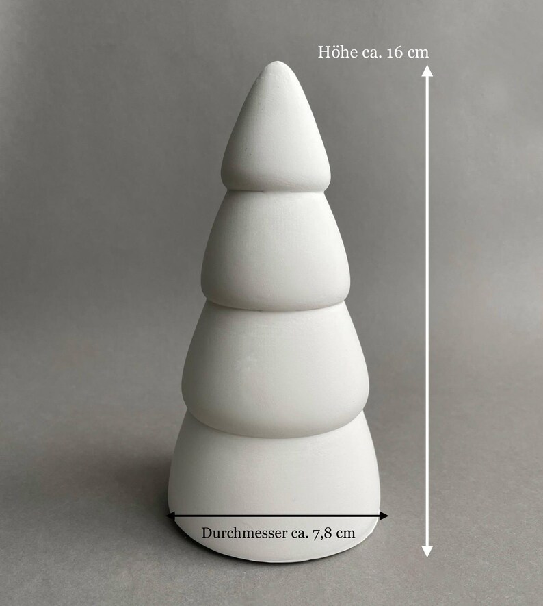 Puede incluir: Adorno de &aacute;rbol de Navidad de cer&aacute;mica blanca con un dise&ntilde;o en capas. El adorno mide 16 cm de alto y 7,8 cm de di&aacute;metro.