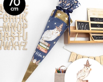 May include: A blue and gold school cone with a white owl and books design. The cone is 70 cm tall and has the name "Milan" written on it.